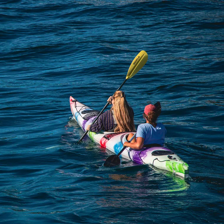 A couple kayaking on a lake